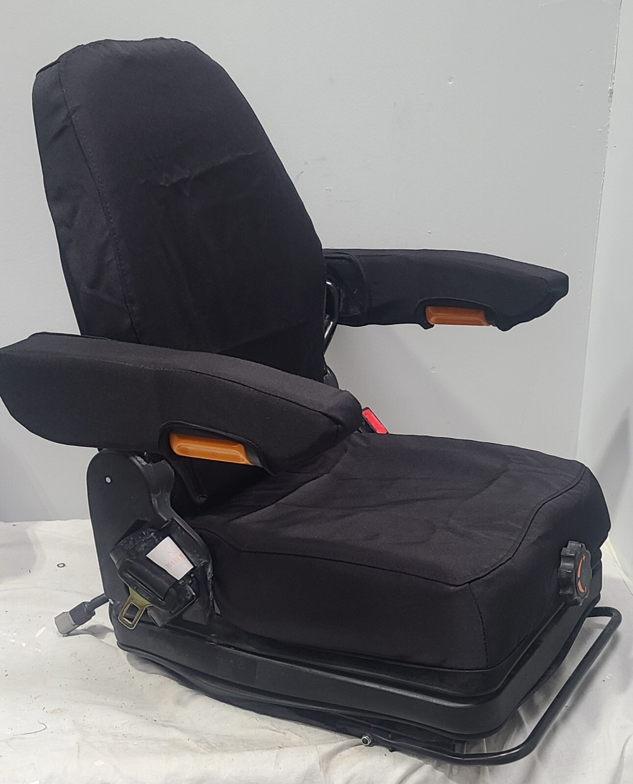 Forklift & Tractor Suspension Seat with Adjustable Armrest Made in Black Endura.
