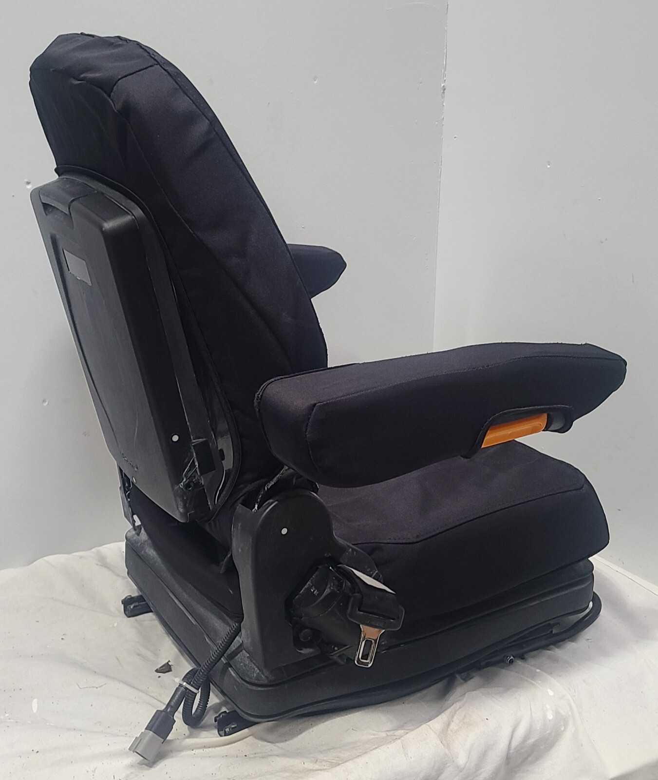 Forklift & Tractor Suspension Seat with Adjustable Armrest Made in Black Endura.