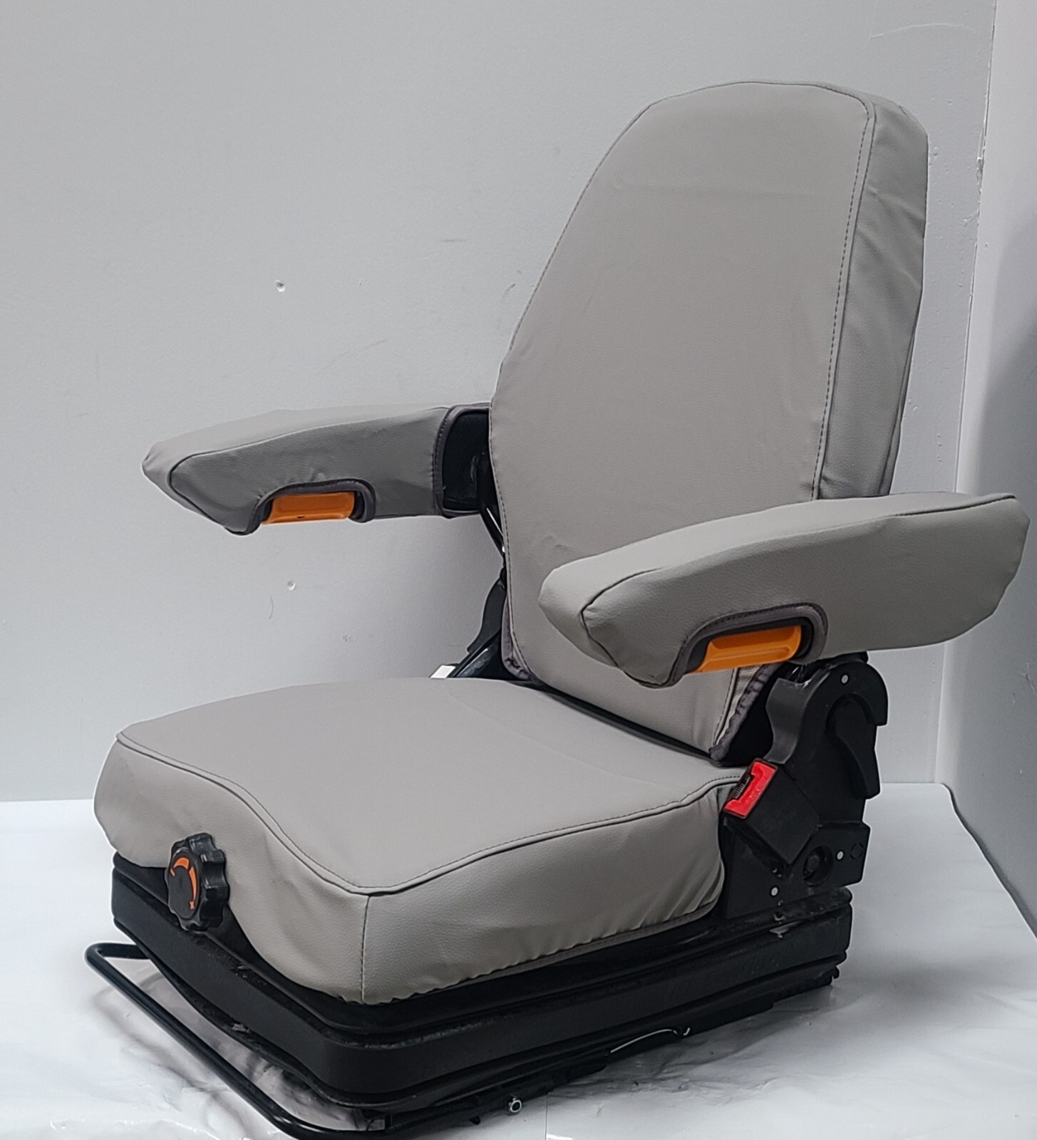 Tractor Suspension Seat w/ Adjustable Armrest Made in Light Gray Leatherette.