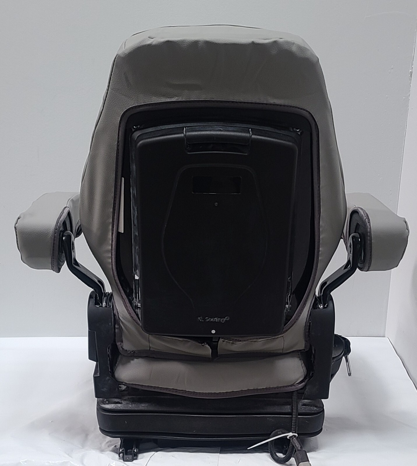 Tractor Suspension Seat w/ Adjustable Armrest Made in Light Gray Leatherette.