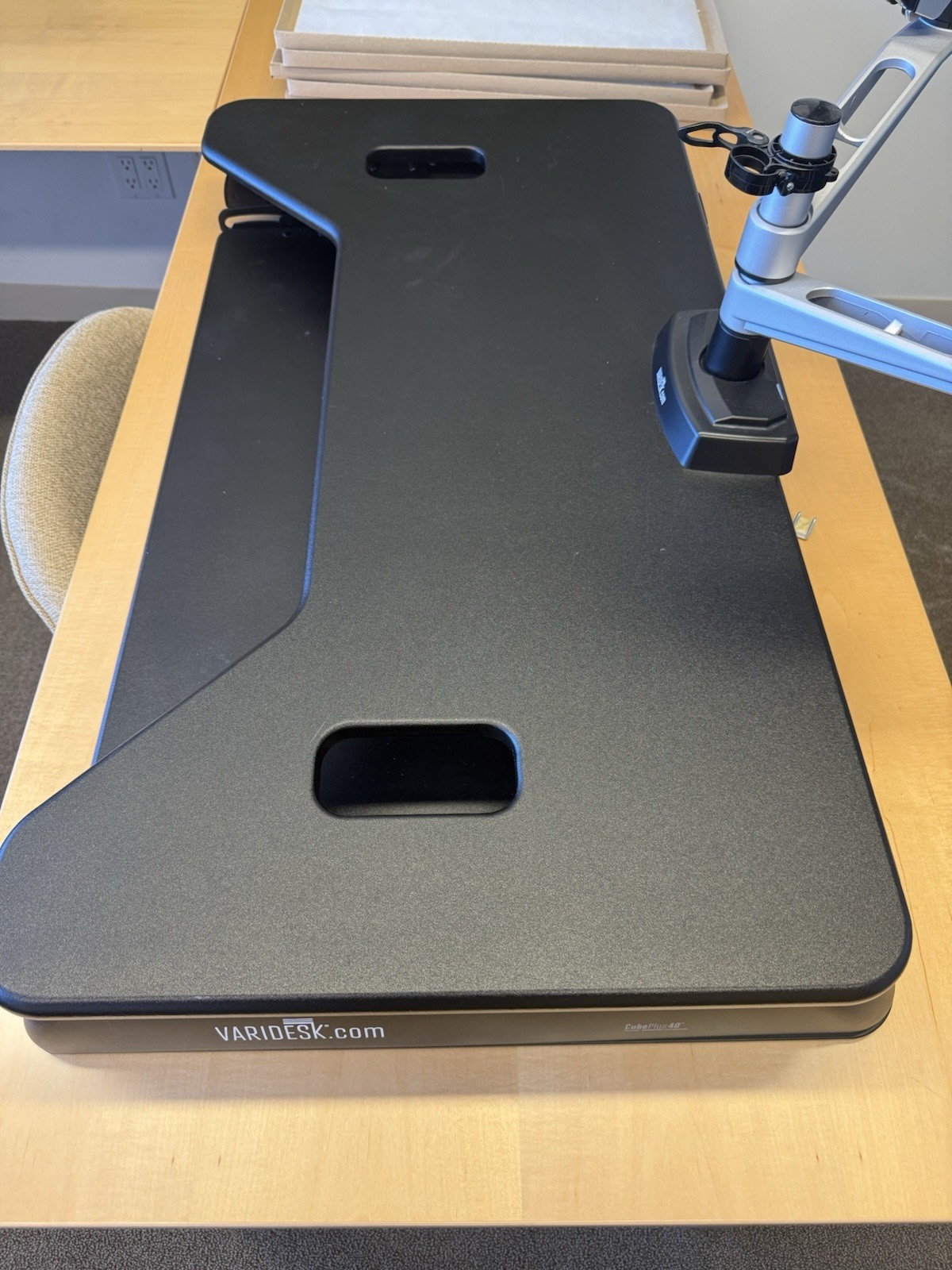 This is a VariDesk Cube Plus 40 standing desk converter in black