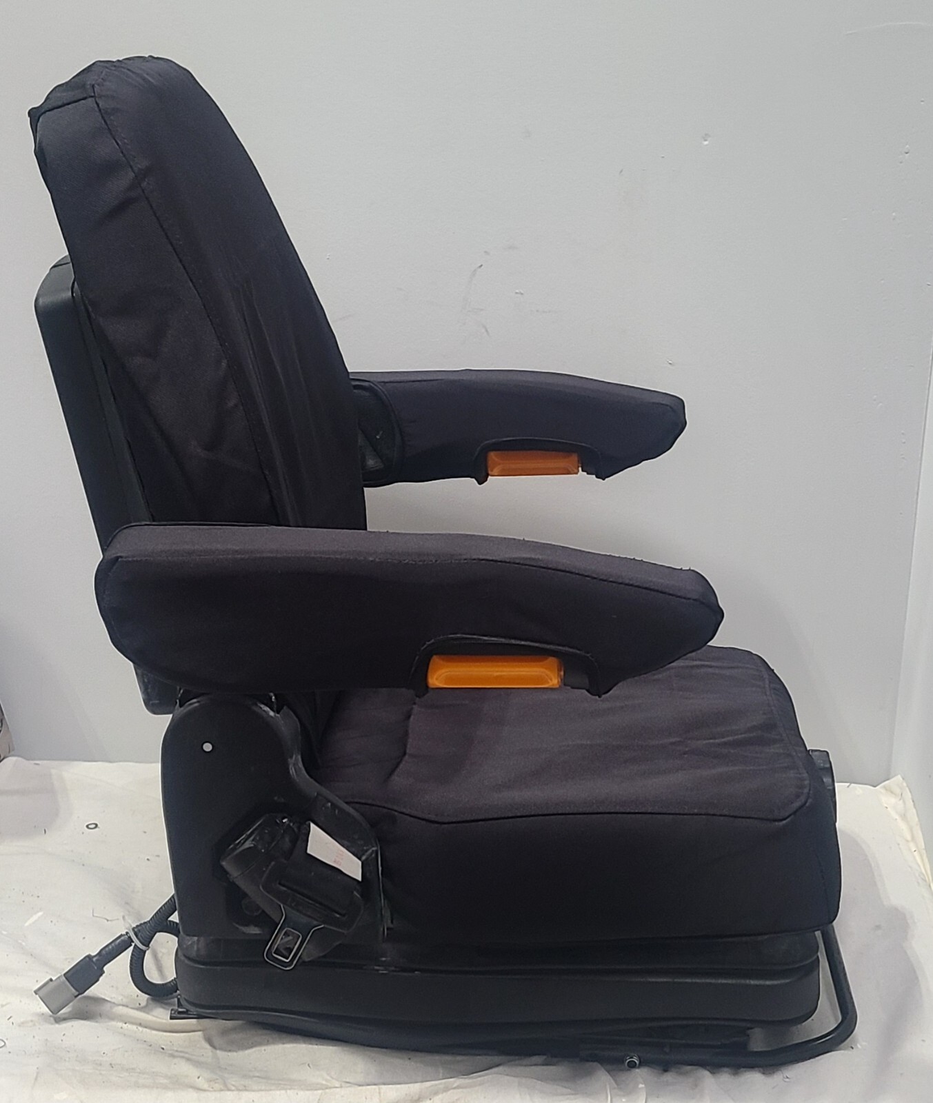 Forklift & Tractor Suspension Seat with Adjustable Armrest Made in Black Endura.