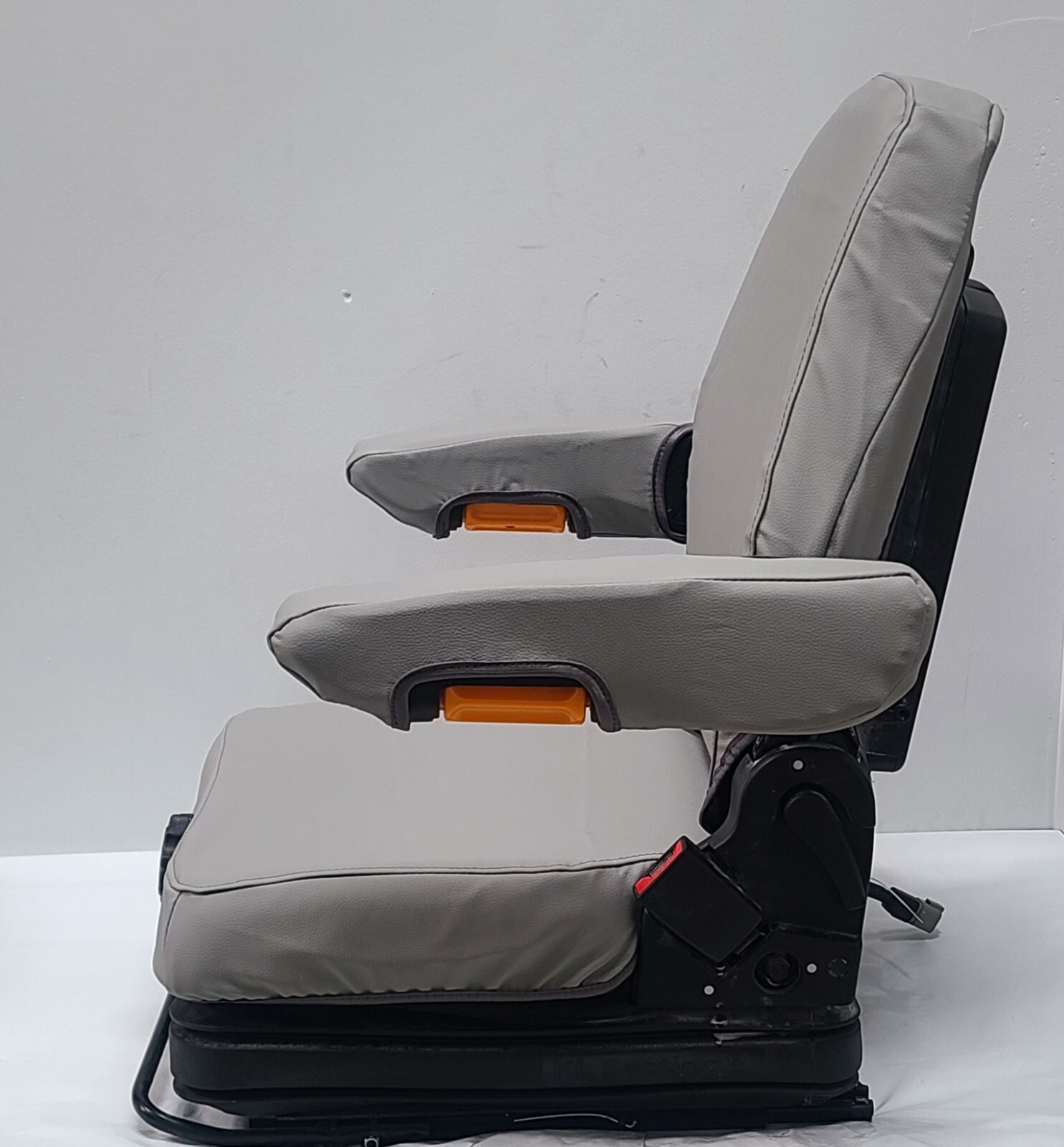 Tractor Suspension Seat w/ Adjustable Armrest Made in Light Gray Leatherette.